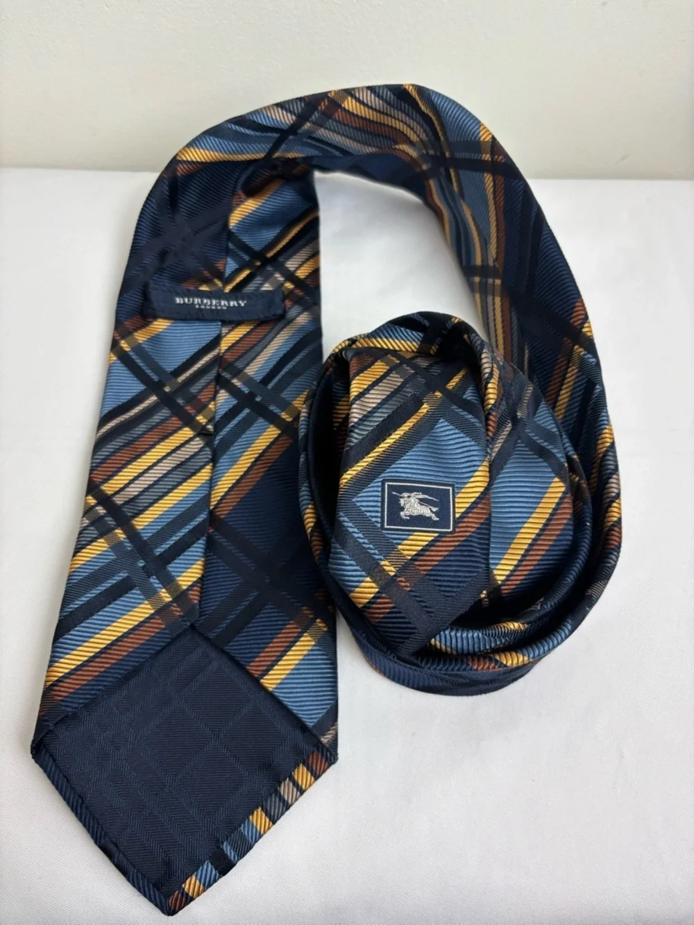 Burberry Silk Tie in Geometric Gold and Navy Blue Pattern